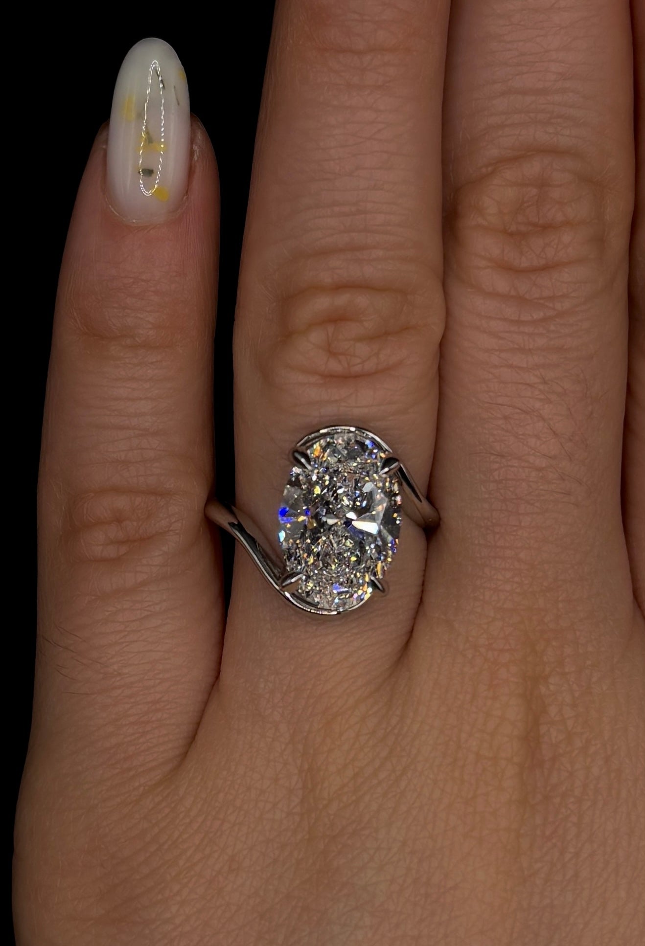 5.00ct Oval Brilliant Cut (D VS1) Diamond Engagement Ring – IGI Certified – Sculptural Bypass Solitaire